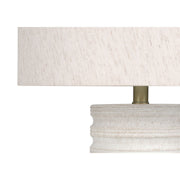 Cream resin transitional table lamp by 8th Street, featuring a sleek modern design with a rounded base and matching shade.