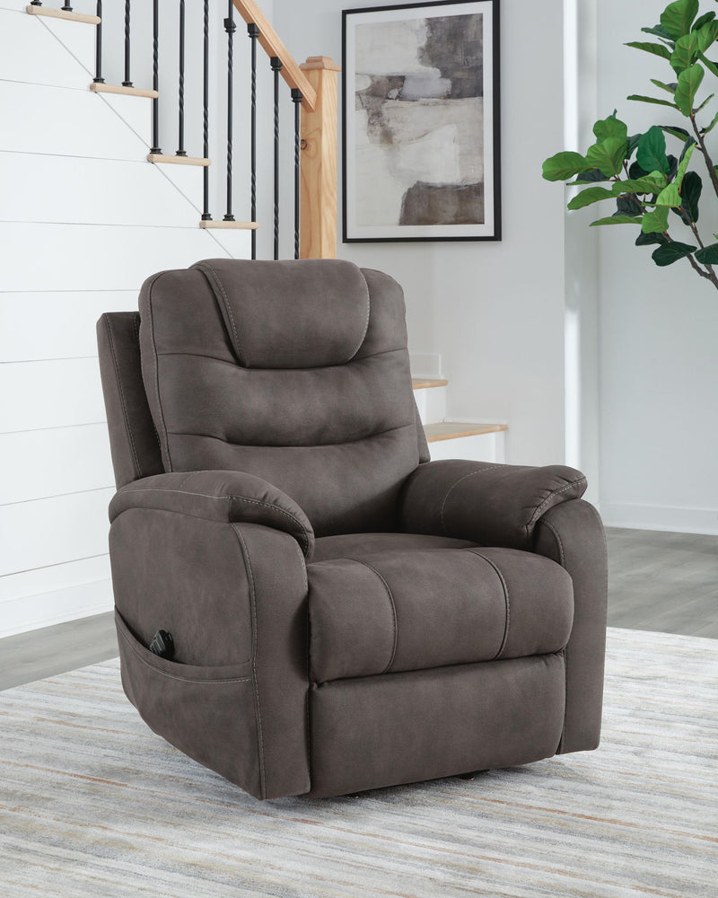 Signature Design by Ashley Snowfield Power Lift Recliner in gunmetal, featuring plush cushioning and a sturdy lift mechanism.