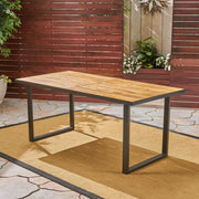 Teak outdoor dining table with U-shaped legs and slat top, ideal for patio or garden seating, by Noble House.
