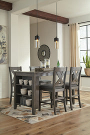 Set of two Signature Design by Ashley Caitbrook gray upholstered barstools with cushioned seats and wooden legs.