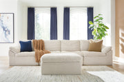 Ivory Fannin 4-piece sectional with matching ottoman by Signature Design Ashley, featuring plush cushions and modern design.