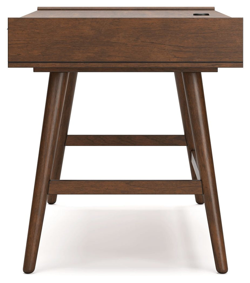 Signature Design by Ashley Lyncott home office desk with a sleek wooden surface and sturdy metal legs for writing and workspace.