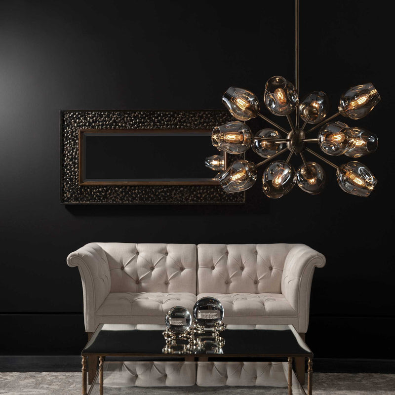 Uttermost Chet 12-Light Sputnik chandelier in light brown with metal and glass globe accents, hanging with a modern design.