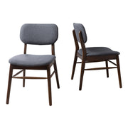 Set of 2 Noble House upholstered comfort dining chairs with padded seats and fabric upholstery, ideal for modern dining rooms.