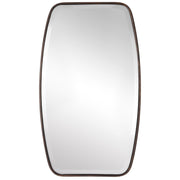Uttermost Canillo wall mirror with a sleek, modern frame hanging on a wall, showcasing contemporary home decor style.