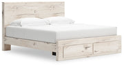 Signature Design by Ashley Lawroy panel storage bed with built-in drawers and modern wood finish in a bedroom setting
