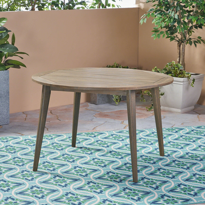Modern Noble House Stamford outdoor dining table with sleek design, featuring a spacious rectangular surface for outdoor gatherings.