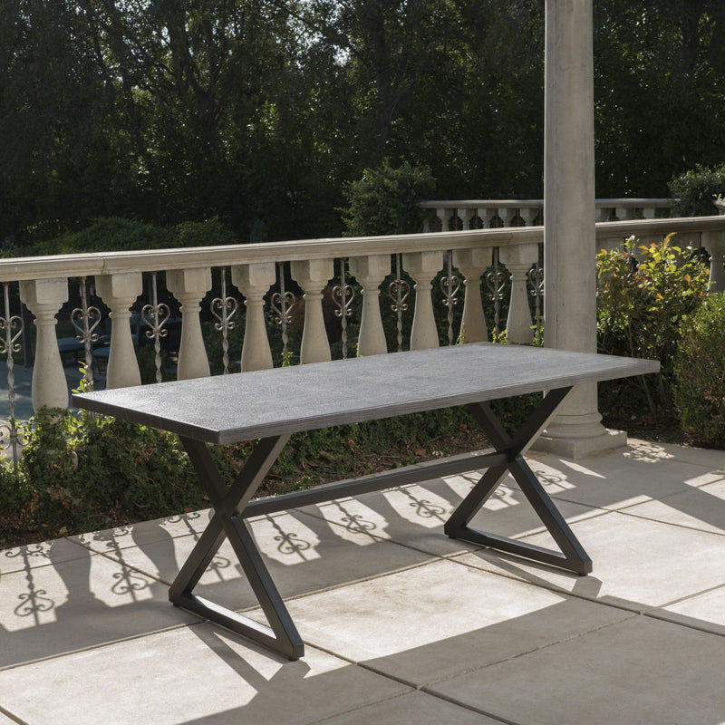Outdoor aluminum dining table with steel frame by Noble House, featuring a sleek, modern design for outdoor dining spaces.