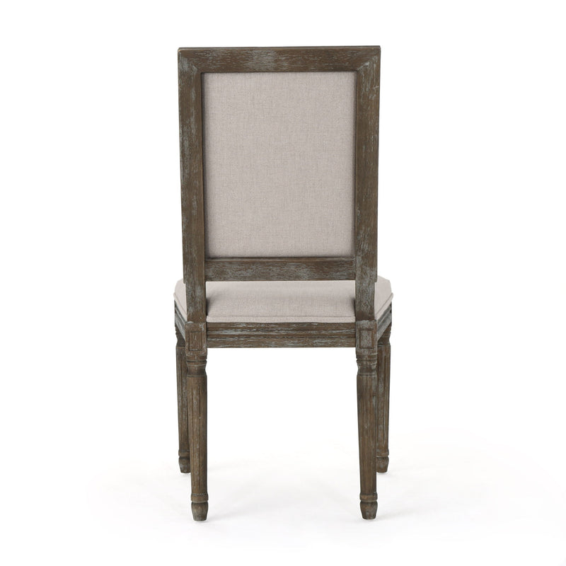Noble House traditional style dining chair set with fabric upholstery, featuring elegant wooden frames and cushioned seats.