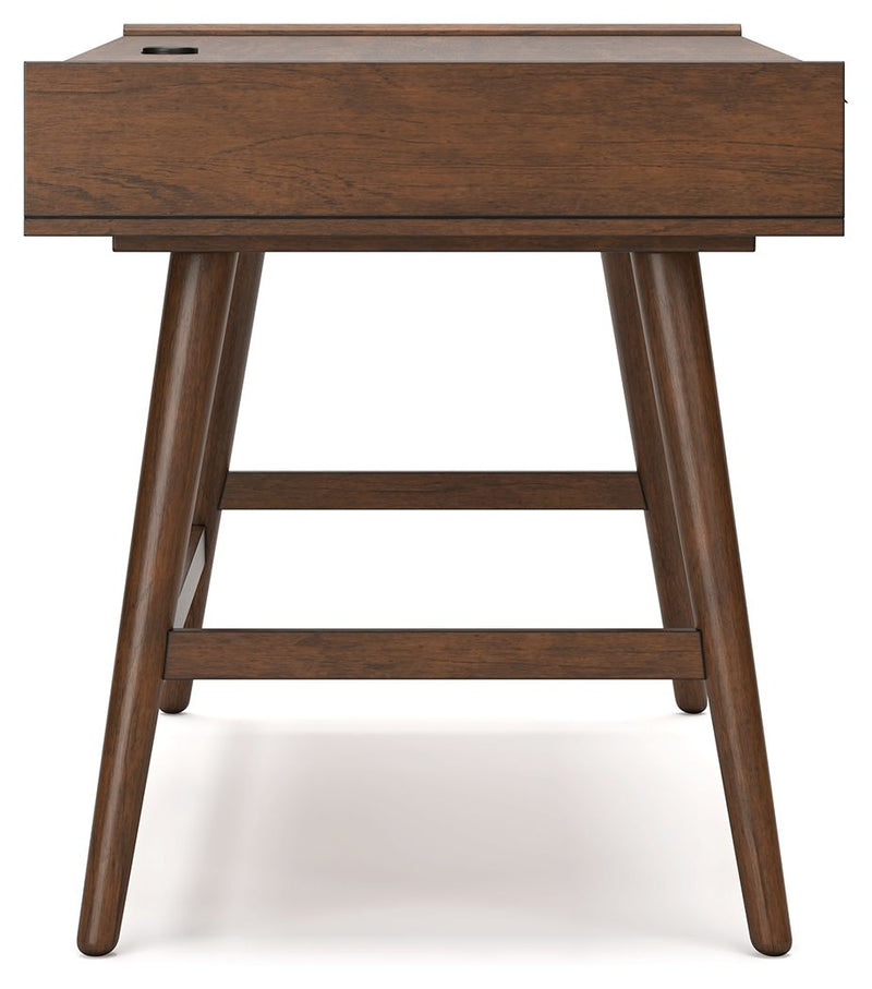 Signature Design by Ashley Lyncott home office desk with spacious surface and modern style, ideal for writing and workspace organization.