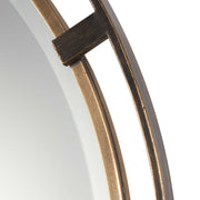 Uttermost Carrizo round wall mirror with bronze finish, featuring a sleek, modern design and a smooth circular frame.