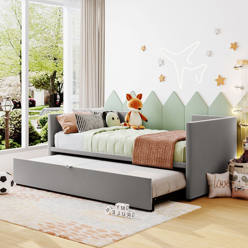 Twin size upholstered daybed with pop-up trundle from Halcyon Home, featuring soft fabric and a modern design with the trundle pulled out.