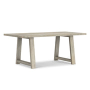 Simpli-Home Whitley dining table with wooden surface and sturdy legs, ideal for modern dining rooms.