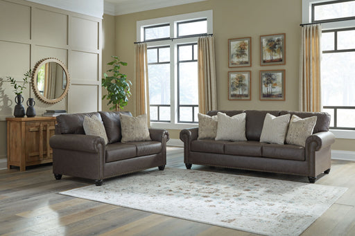 Benchcraft Roxmere living room set with stationary chair and matching ottoman in a modern, comfortable design.