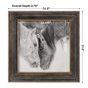 Framed print of black and white horses by Uttermost featuring dark brown accents, showcasing detailed horse artwork.