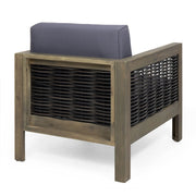 Outdoor acacia wood club arm chair with wicker accents, rustic design, and cushioned seat for comfortable outdoor seating.