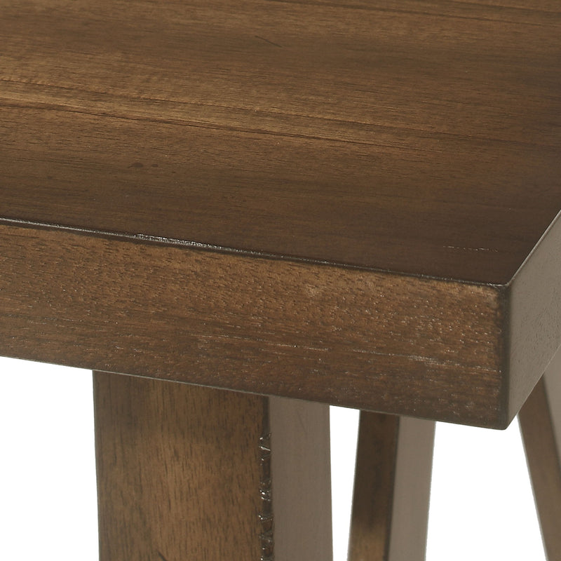 Noble House farmhouse style dining table with a wood-like top, sturdy design, perfect for rustic or casual dining spaces.