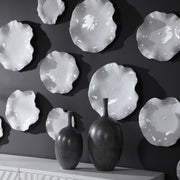 Set of three ceramic wall decor pieces by Uttermost, featuring modern abstract designs for stylish home wall accents.