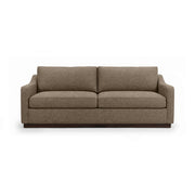 Classic Home Aspen stationary sofa with plush cushions and modern design, shown in a cozy living room setting.