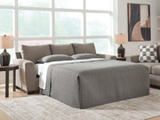 Loreo sofa sleeper by Benchcraft® featuring a modern design with plush cushions and a fold-out bed for versatile living space.