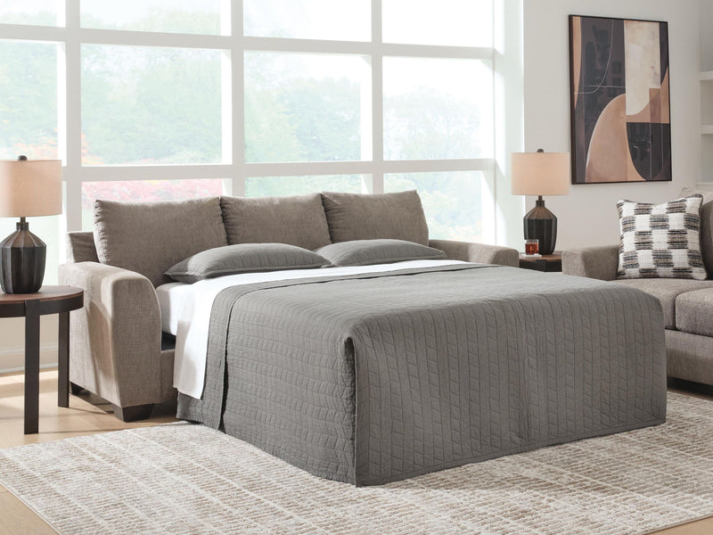 Loreo sofa sleeper by Benchcraft® featuring a modern design with plush cushions and a fold-out bed for versatile living space.