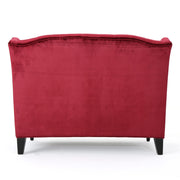Noble House upholstered loveseat with wingback design, diamond tufting, and plush cushioning in a cozy stationary seating style.