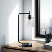 Modern black 8th Street table lamp with glass shade and built-in USB port, perfect for stylish bedside or desk lighting.