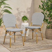 Set of two Noble House outdoor rattan and aluminum armless French bistro chairs in dark gray, suitable for patio or garden seating.