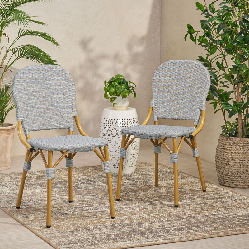 Set of two Noble House outdoor rattan and aluminum armless French bistro chairs in dark gray, suitable for patio or garden seating.