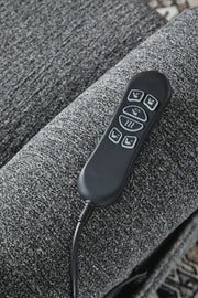 Signature Design by Ashley Aureta Power Lift Recliner in neutral fabric with plush cushioning and sturdy armrests.