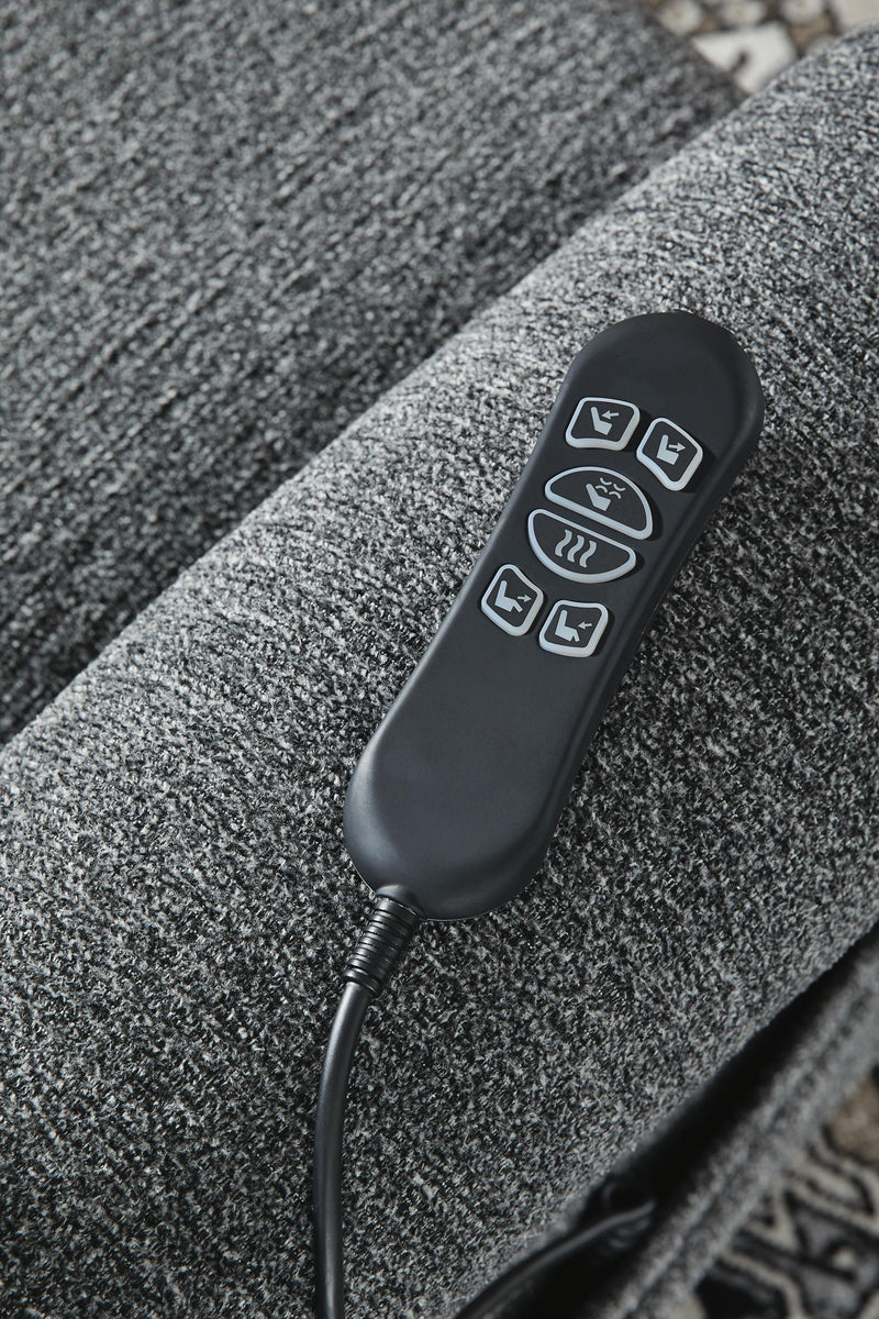 Signature Design by Ashley Aureta Power Lift Recliner in neutral fabric with plush cushioning and sturdy armrests.
