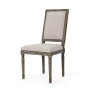 Noble House traditional style dining chair set with fabric upholstery, featuring wooden legs and cushioned seats.