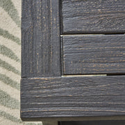 Dark gray Noble House Realm outdoor bench with slat panel top and base, showcasing a sturdy, stylish outdoor seating design.