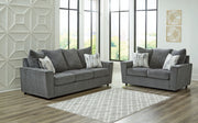 Signature Design by Ashley® Stairatt living room set with stationary chair and matching ottoman in stylish fabric.