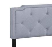 Button tufted upholstered bed from Glory Furniture, showcasing a cozy, elegant design with plush fabric and tufted headboard.