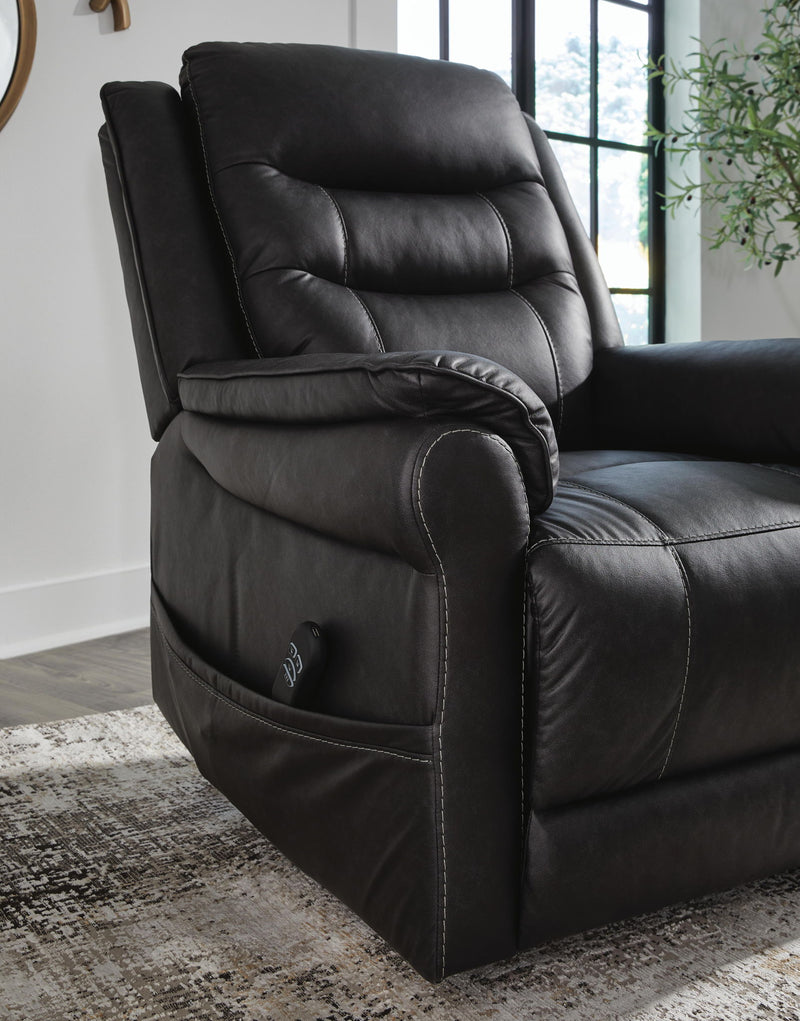 Signature Design by Ashley Oatman power lift recliner in neutral fabric, showing its plush cushioned back and armrests.