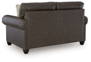 Benchcraft Roxmere living room set with stationary chair and matching ottoman in a cozy, modern fabric design.