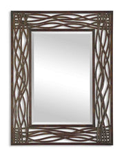 Uttermost Dorigrass metal wall mirror with a brown finish, featuring a circular design and modern aesthetic for stylish wall decor.