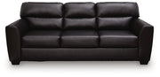 Midnight-colored Glennbre stationary sofa by Signature Design by Ashley® with plush cushions and sleek fabric upholstery.