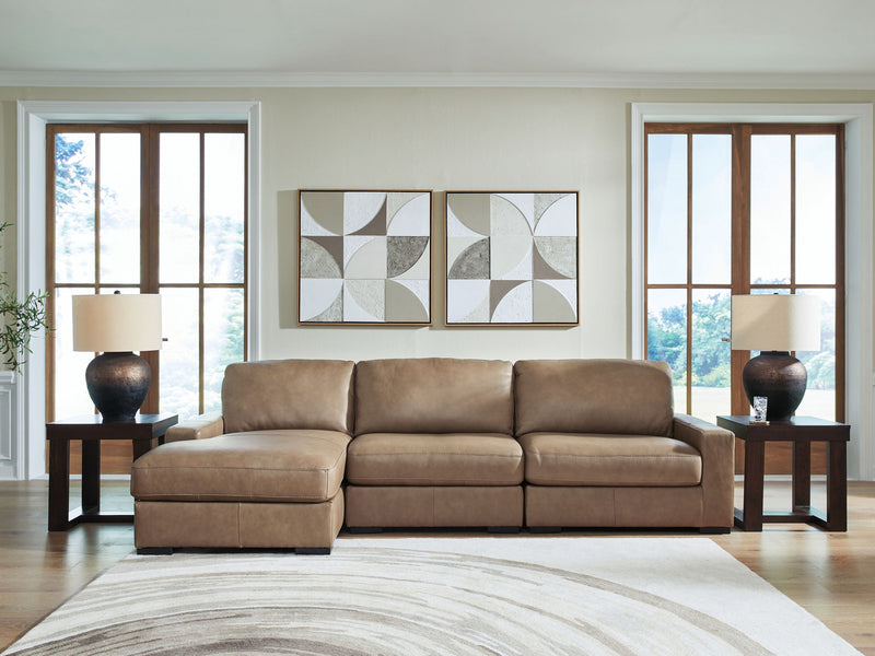 Benchcraft Veronella stationary sectional sofa with plush cushions and modern design, shown in a stylish living room setting.