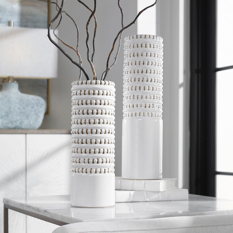 Set of two white Angelou vases by Uttermost, elegant ceramic vases with smooth finish, perfect for decorative displays.