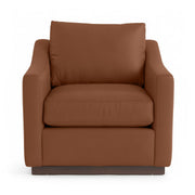Classic Home Aspen accent arm chair with plush upholstery and wooden legs in a cozy, stylish living room setting.
