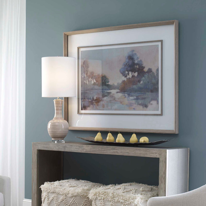 Watercolor framed print titled Morning Lake by Uttermost featuring a serene blue lakeside scene, ready for wall display.