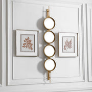 Uttermost wall mirror with a button-style frame, featuring a sleek, modern design perfect for contemporary home decor.