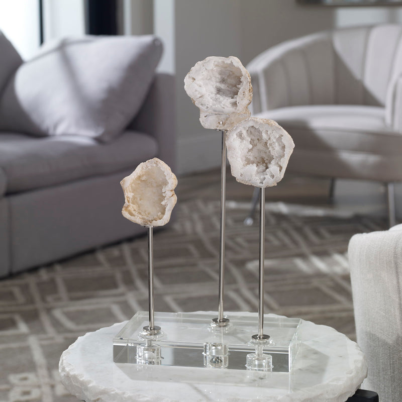 White natural stone sculpture from Uttermost's Cyrene collection, featuring a smooth, abstract figurine for decorative display.