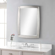 Uttermost Haskill wall mirror with brushed nickel frame, rectangular shape, modern design, hanging on a wall.
