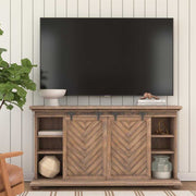Uttermost Primalia barn door media console in light brown wood with sliding barn door design, ideal for TV and media storage.