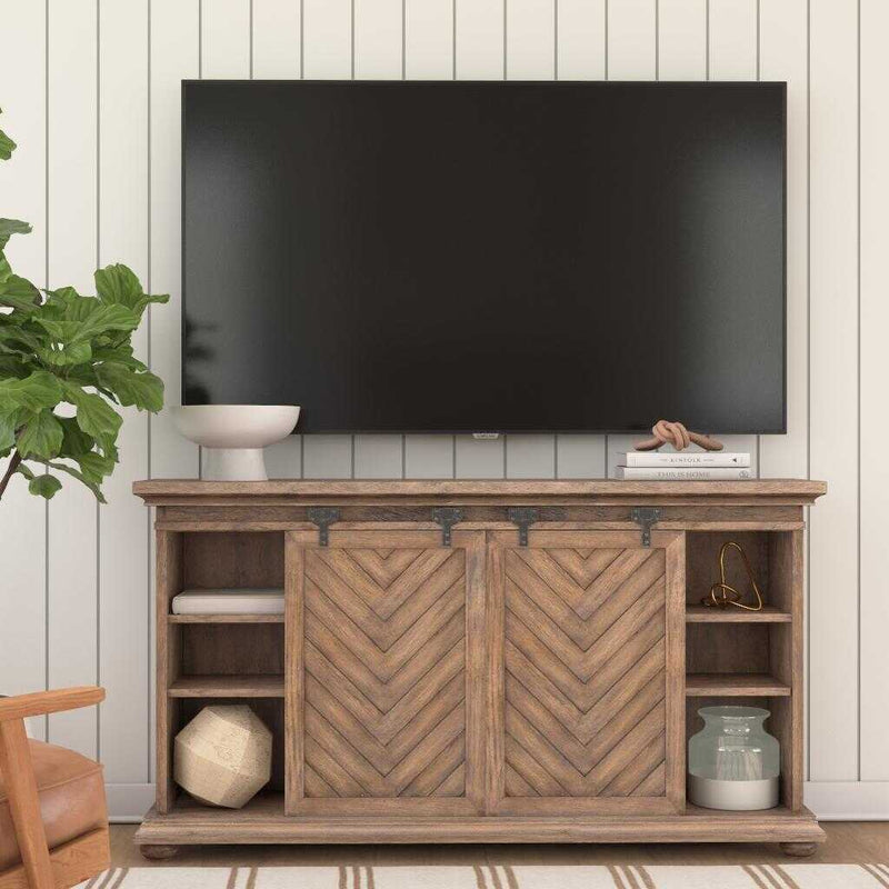 Uttermost Primalia barn door media console in light brown wood with sliding barn door design, ideal for TV and media storage.