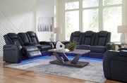 Signature Design by Ashley reclining living room set with plush sofas and loveseats, featuring padded armrests and reclining mechanisms.