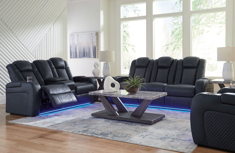 Signature Design by Ashley reclining living room set with plush sofas and loveseats, featuring padded armrests and reclining mechanisms.